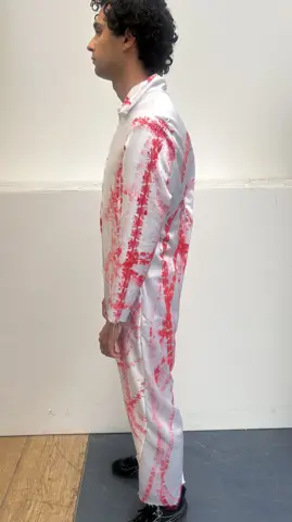 Back view of the red-track jumpsuit